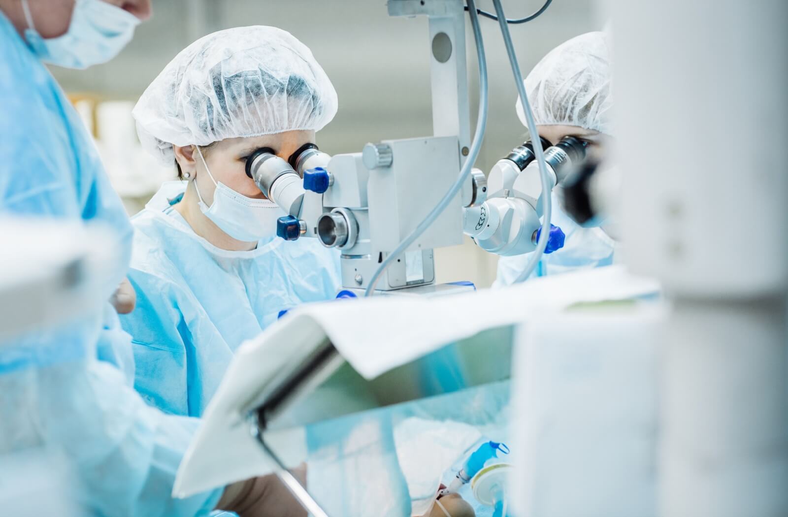 An ophthalmic surgeon performing LASIK surgery on a patient