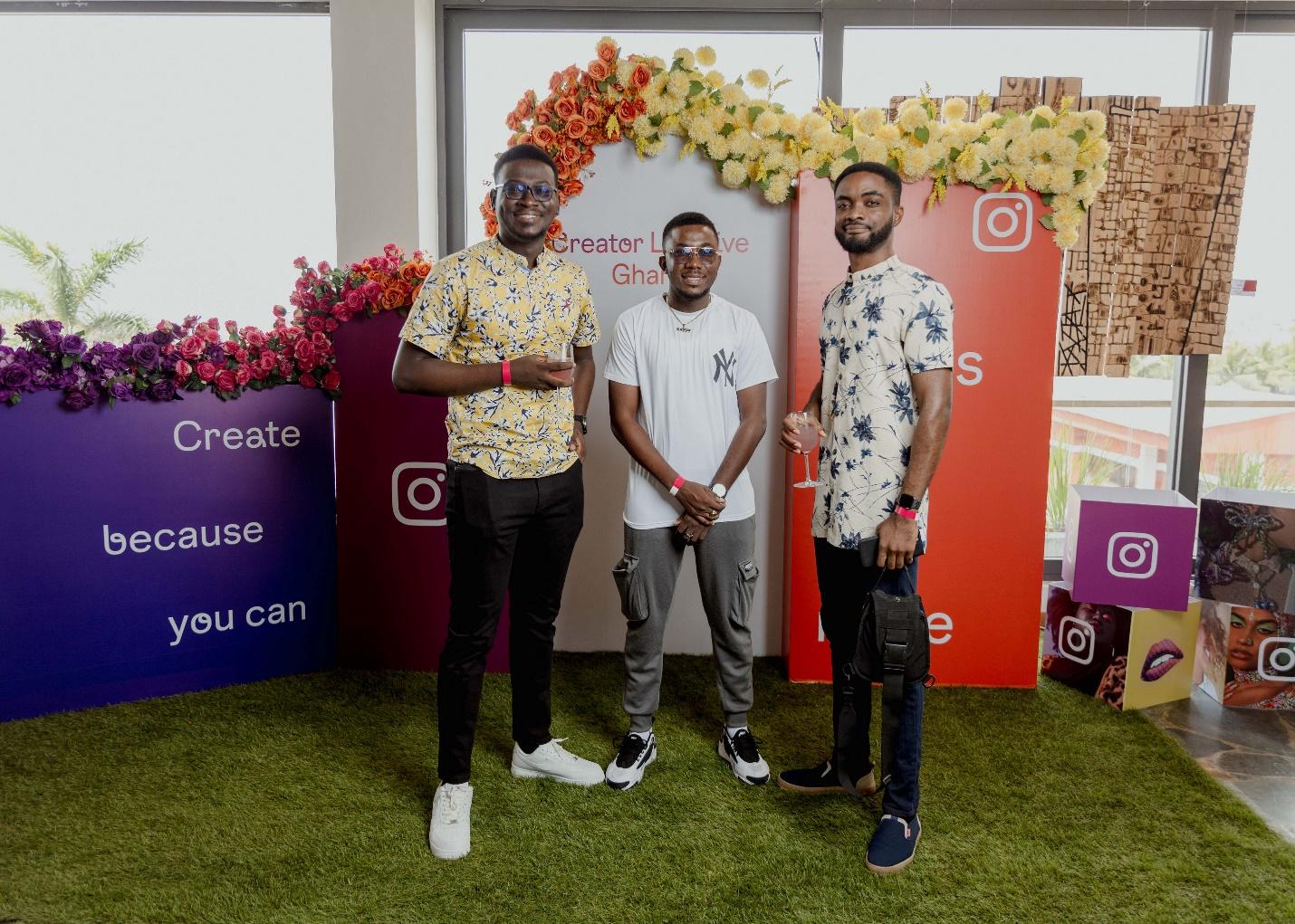 A group of men standing in front of a sign

Description automatically generated