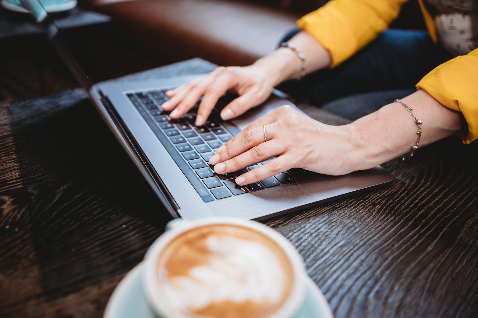 a person typing on a laptop