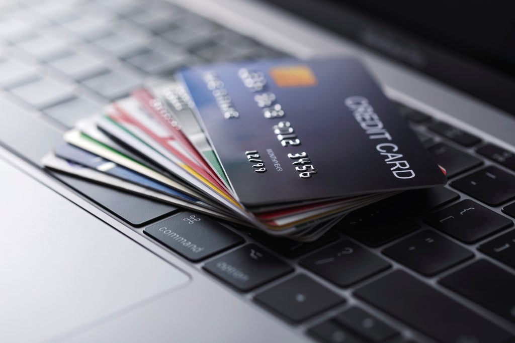 Credit cards placed on a laptop