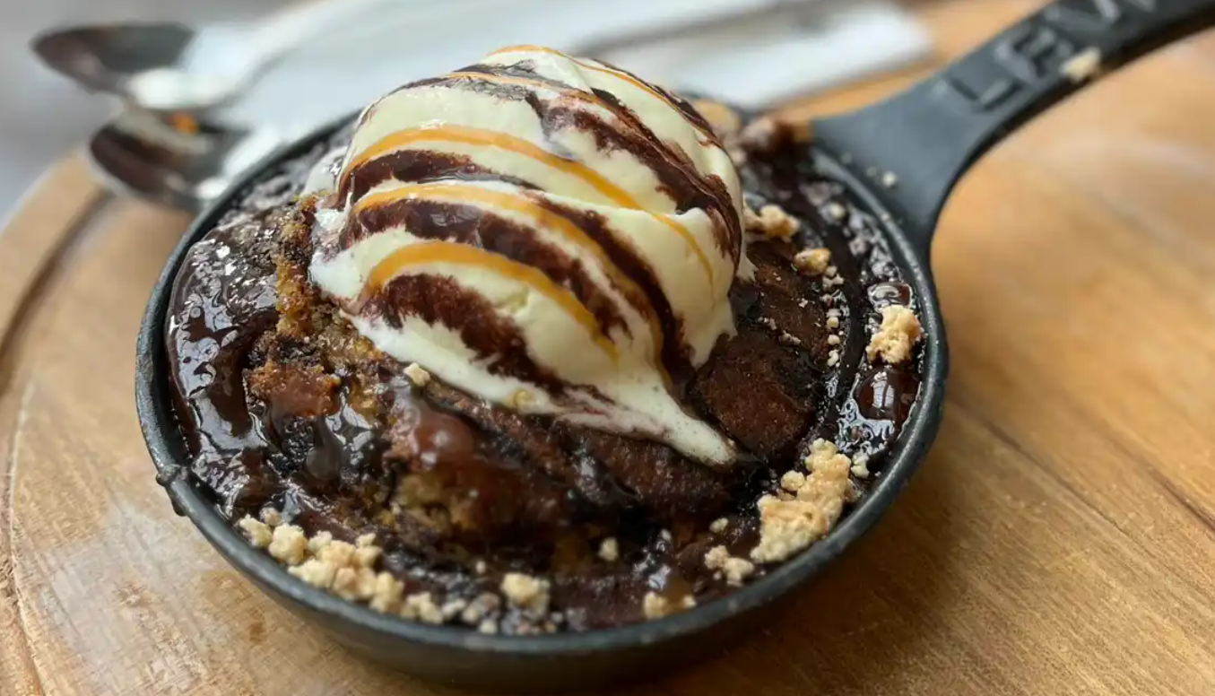 A skillet with a dessert on it

Description automatically generated