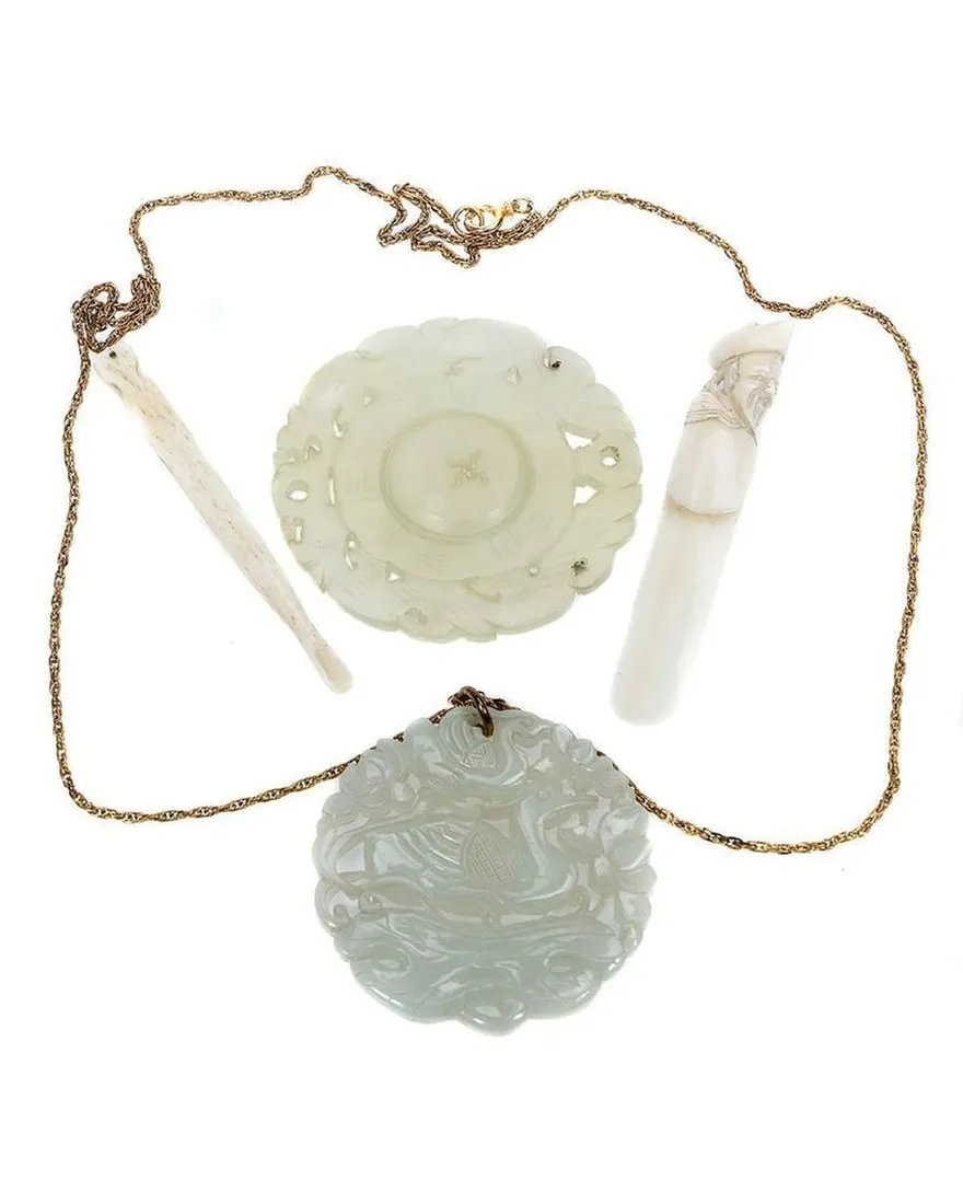 A necklace with a pendant and a pendentDescription automatically generated