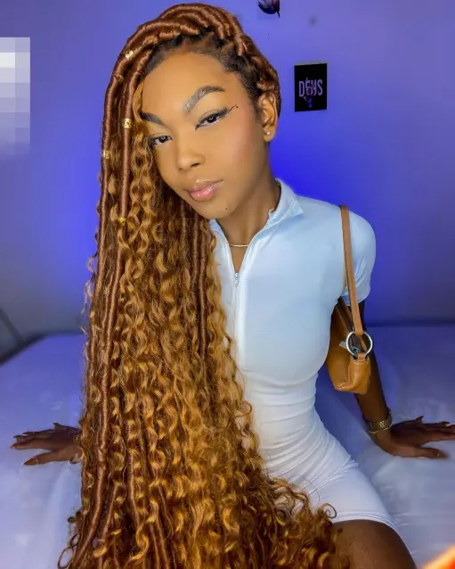 Picture of a lady rocking extra long curls with locs