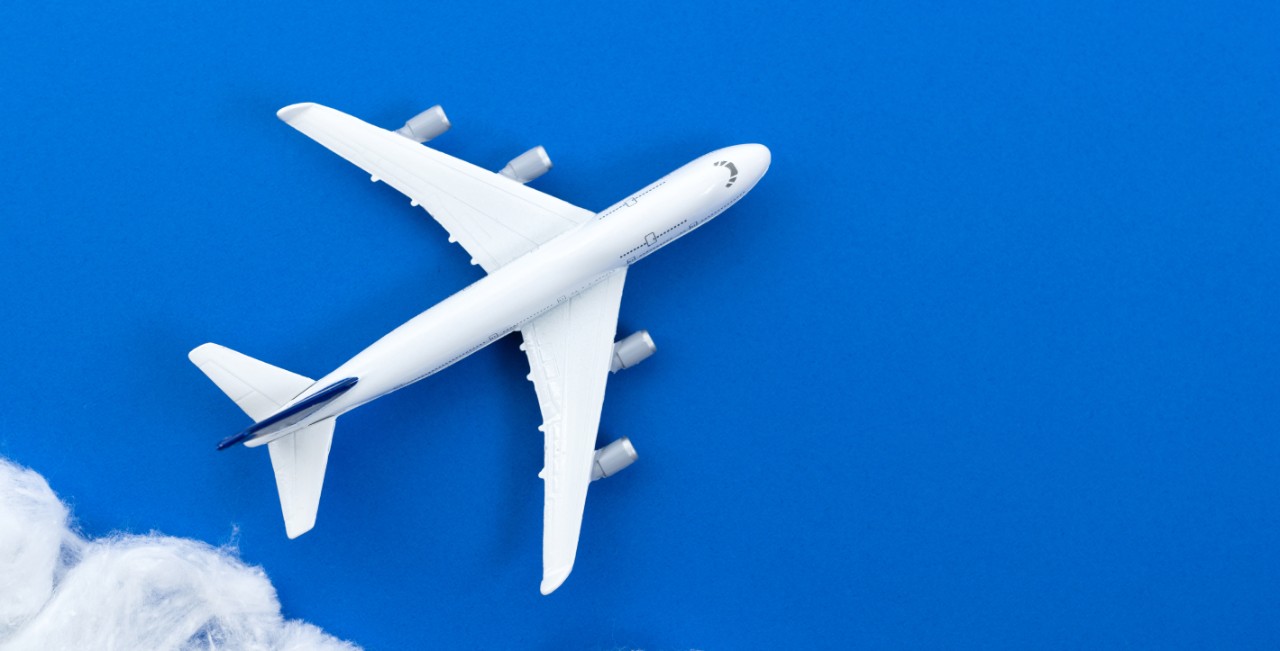 Toy airplane on blue background