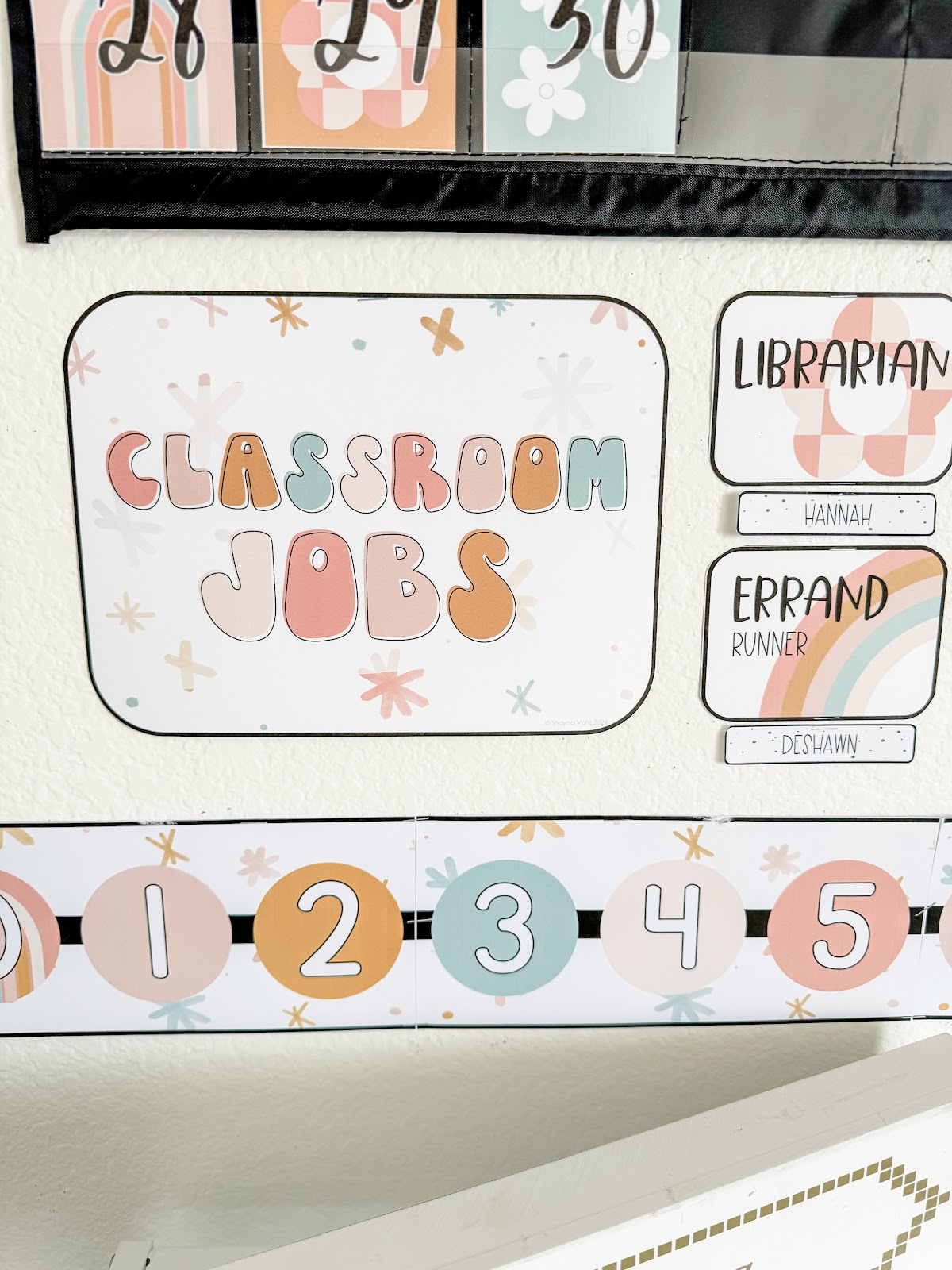 This image shows a close-up of a number line in a pastel retro classroom theme. 