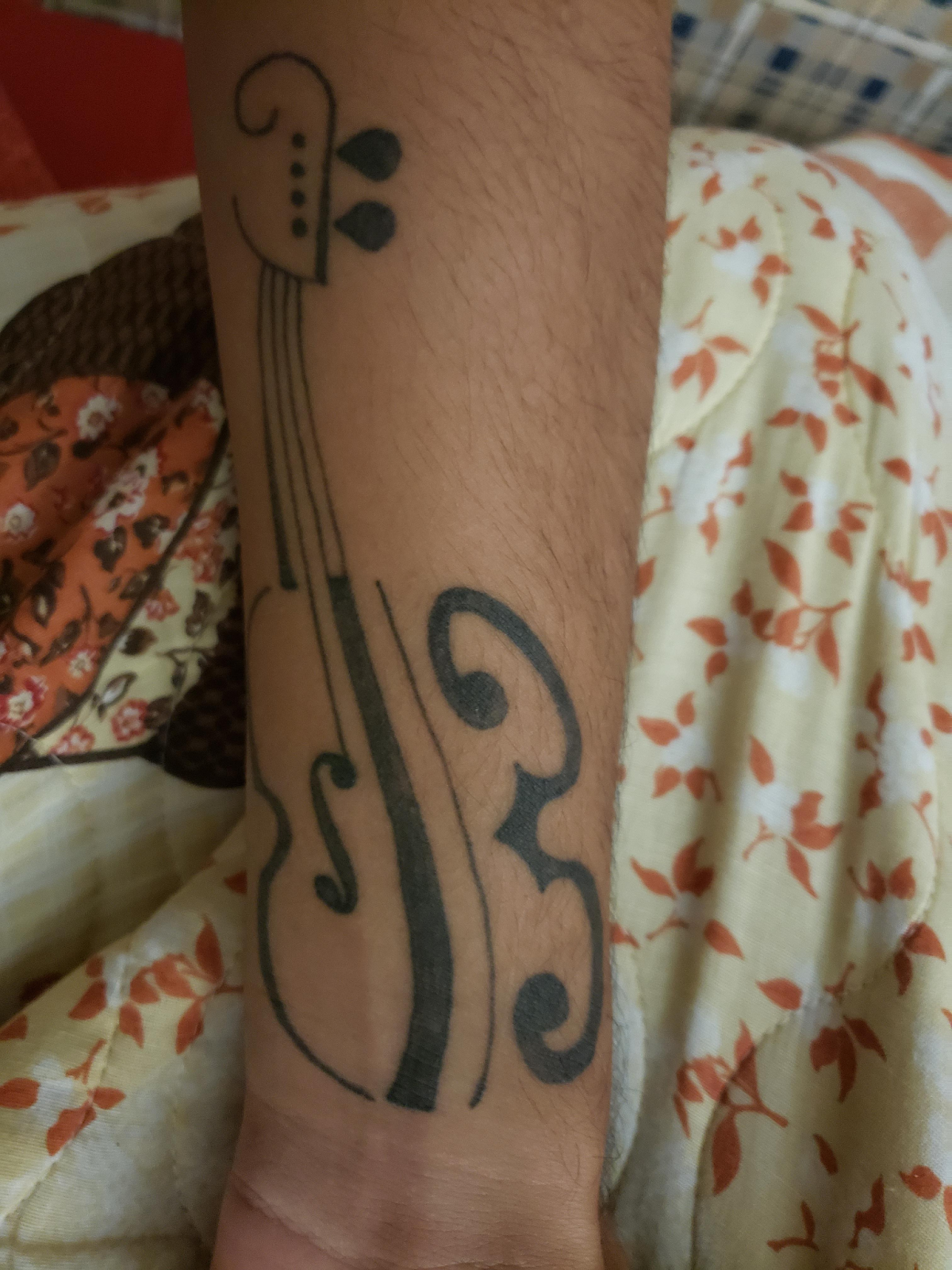 Alternate design viola tattoo on ankle