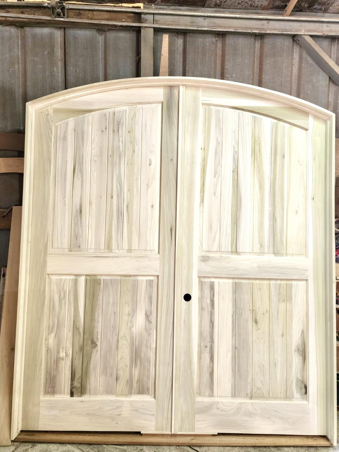 A wooden door in a barn Description automatically generated