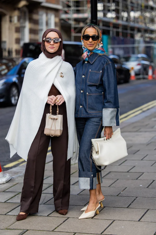 London Fashion Week AW24: Picture showing two attendee rocking the mob wife aesthetic in style