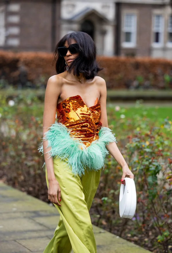 Picture showing an attendee rocking the topless dress with pants for the fashion show