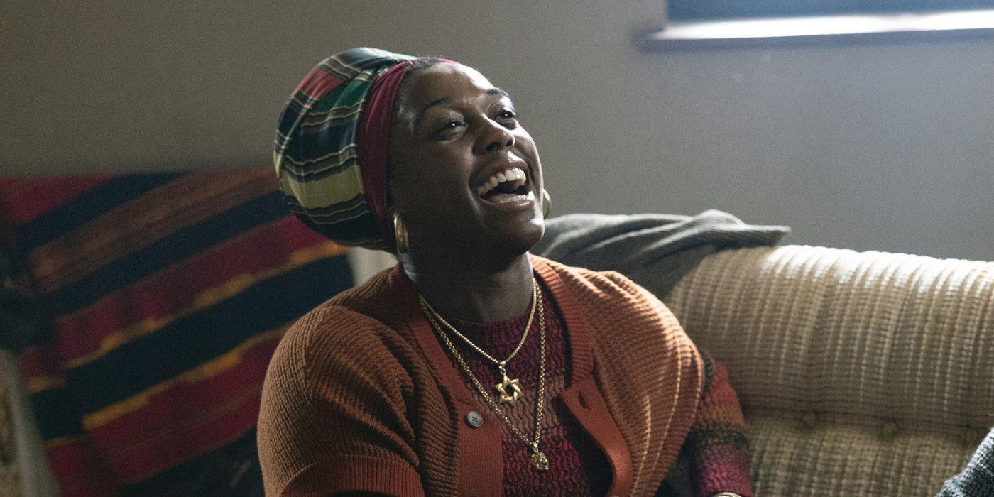 Rita Marley played by Lashana Lynch laughing in Bob Marley: One Love