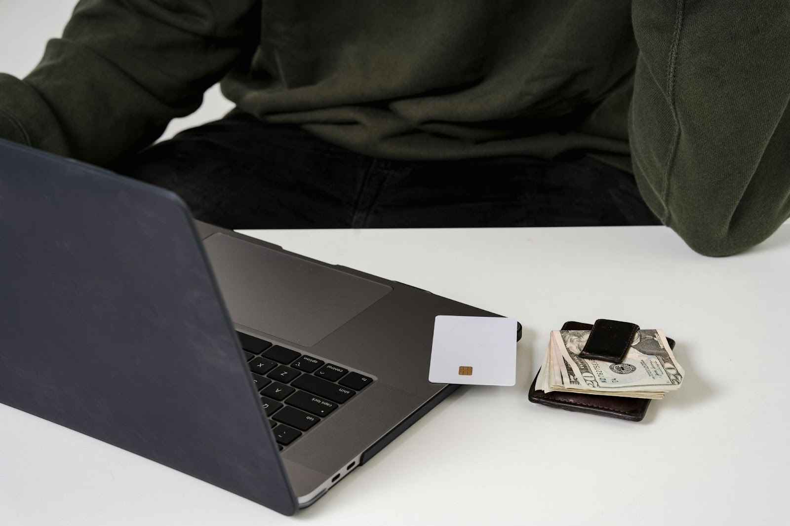 laptop, card and money