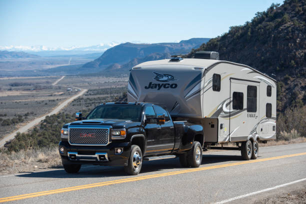 Towing travel trailer along  mountain road 