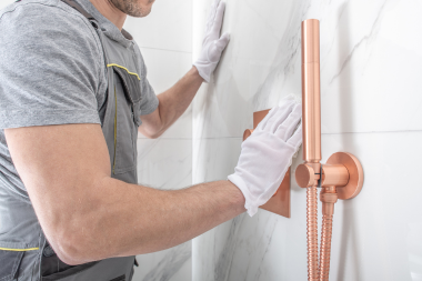 common planning mistakes to avoid for your home remodel contractor installing bathroom shower tiles custom built michigan