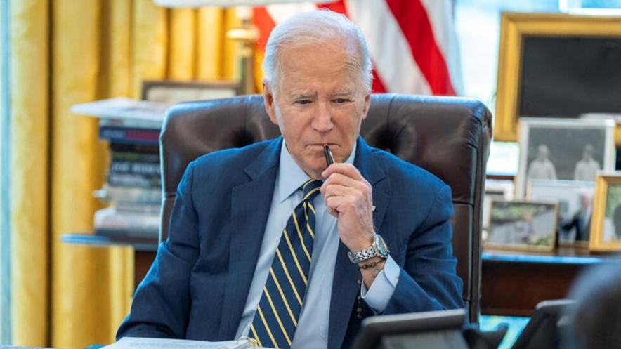 U.S. President Joe Biden speaks on the phone with Israeli Prime Minister Benjamin Netanyahu in this White House handout image taken in the Oval Office in Washington, U.S., April 4, 2024.