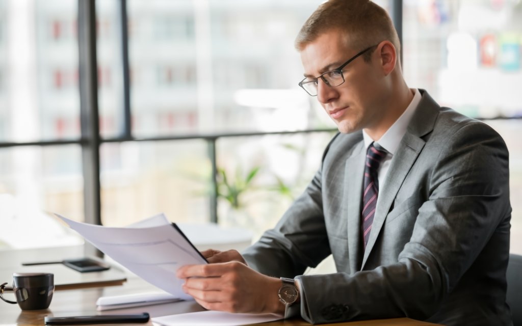 Man looking at a report