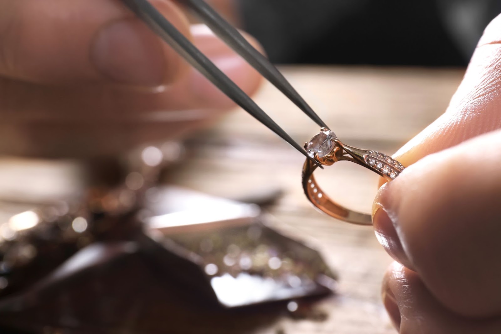 an image of a jeweler creating a custom wedding band.
