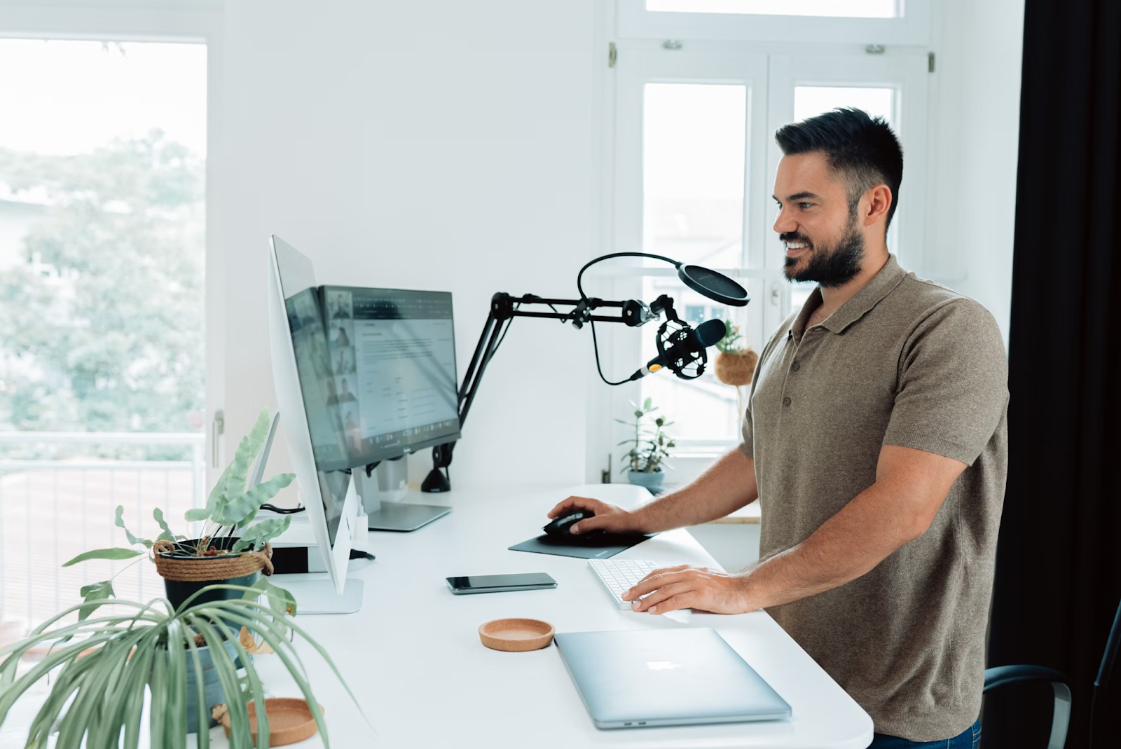 A man using a dedicated microphone on a video call