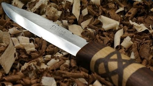 Free Knife on Top of wood Shavings Stock Photo