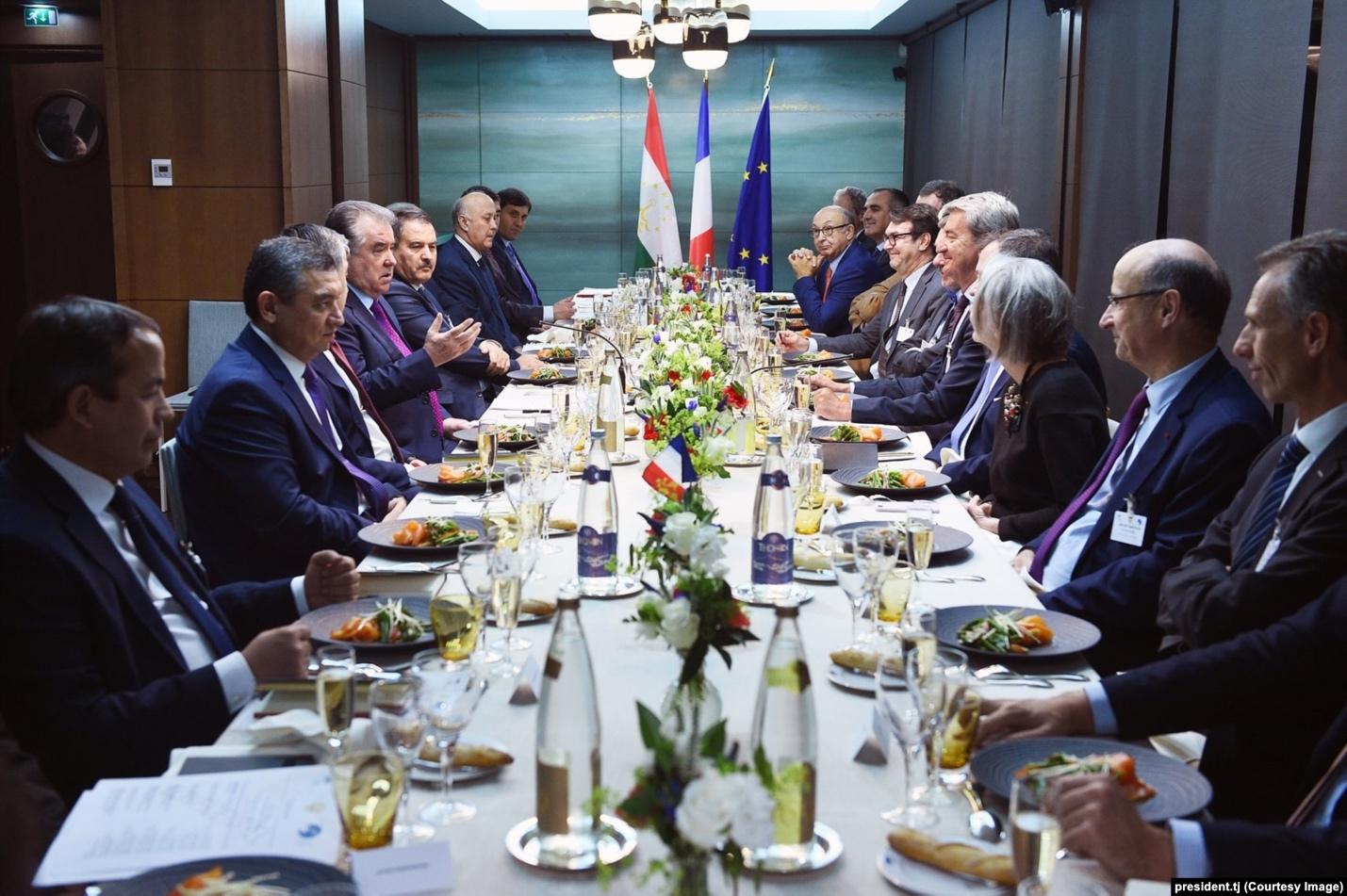 Tajik President Emomali Rahmon (left, gesturing) at a meeting of the Tajik-French Business Council in Paris on November 17, 2019. As a result of the meeting, Rahmon's daughter's company, Sifat Pharma, signed an agreement with a French partner.