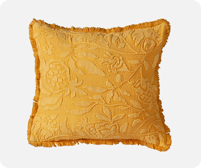 Our golden yellow Catarina Square Cushion Cover on a white background.