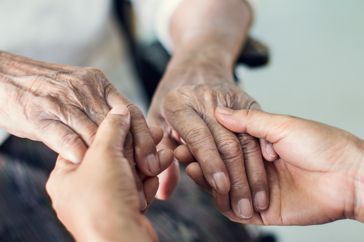 Seniors holding hands