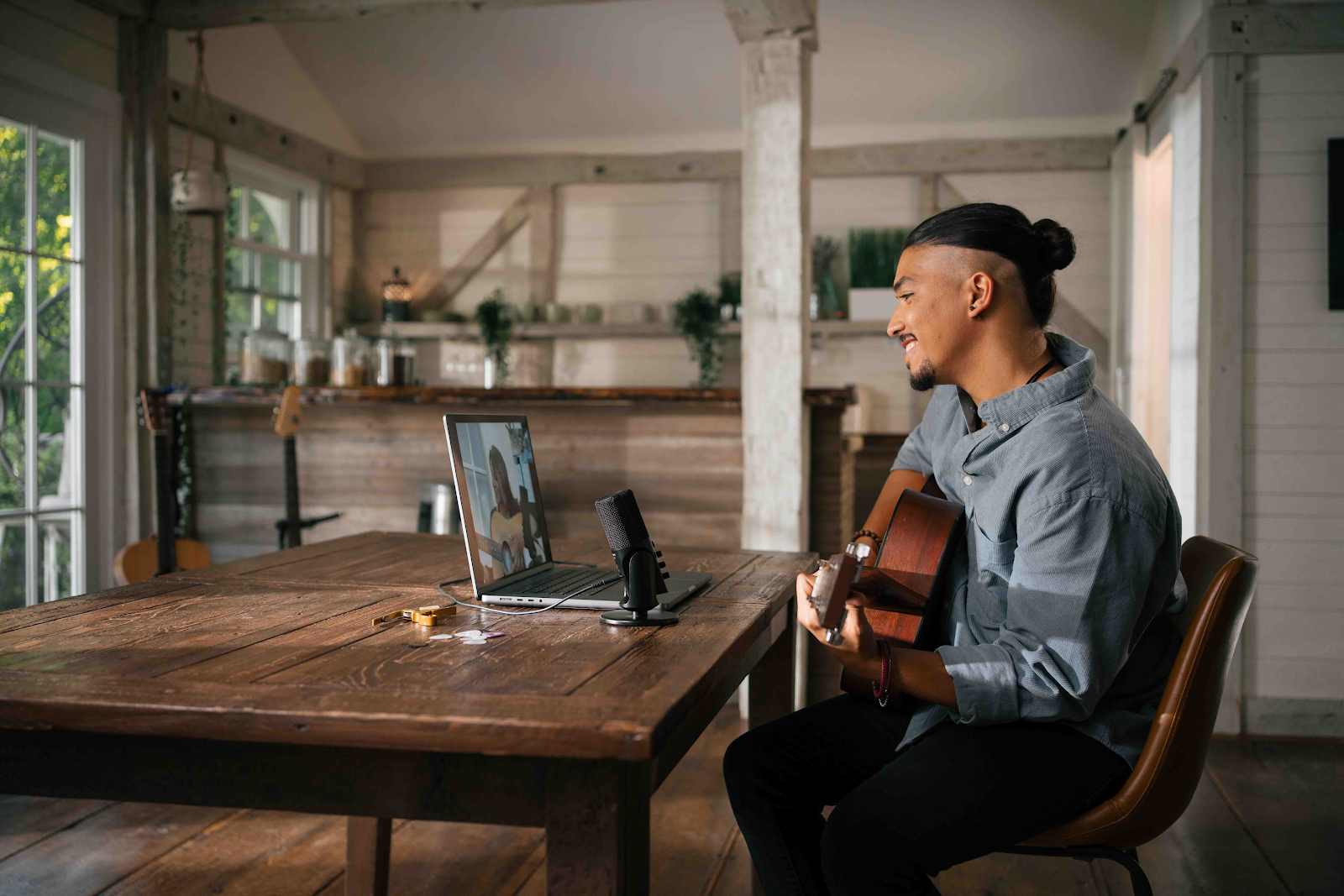 A person sitting at a table with a computer

Description automatically generated with medium confidence