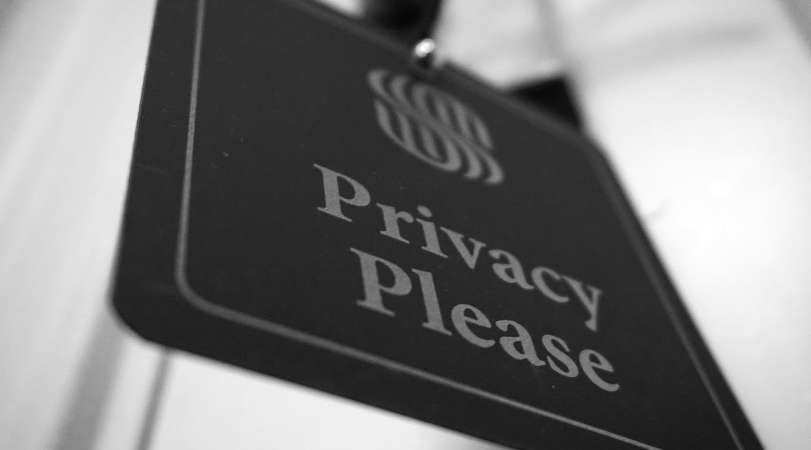 An image of a signage with the word 'Privacy Please'