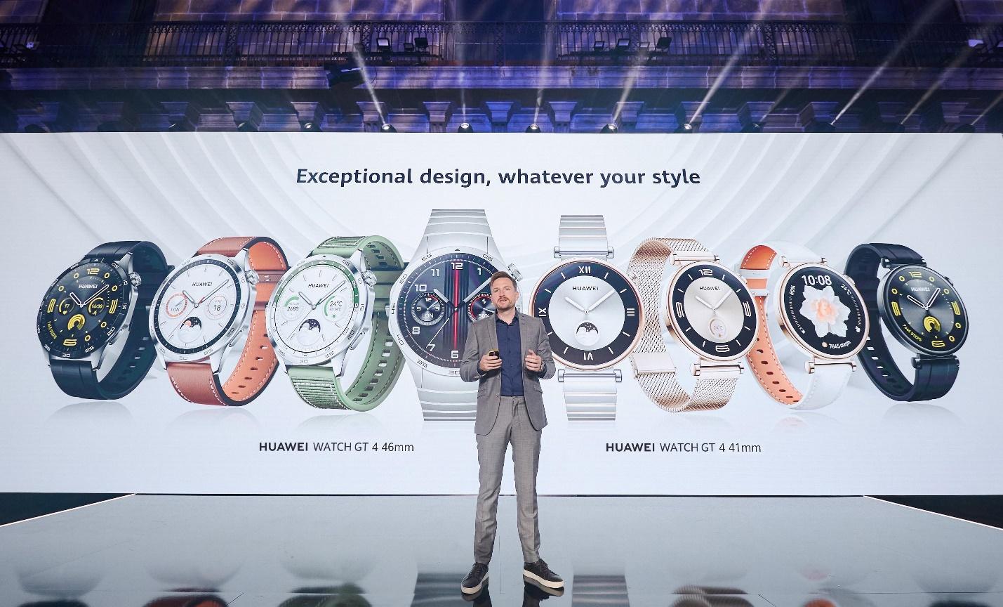 A person standing in front of a large screen with watches

Description automatically generated