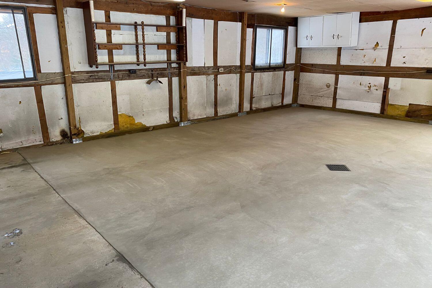 Completed concrete floor replacement inside of a residential garage