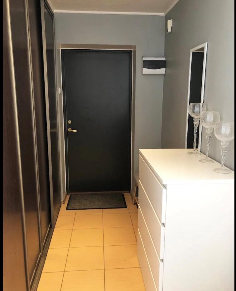 A bathroom with a black doorDescription automatically generated with low confidence