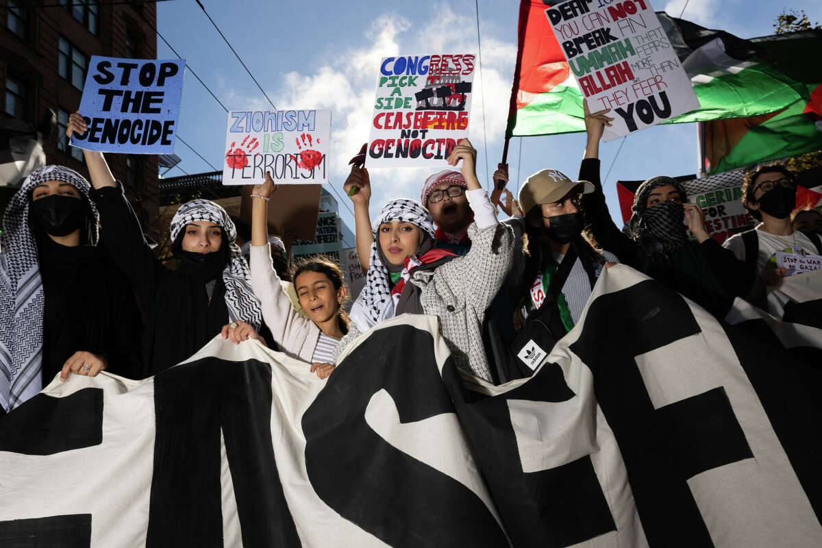 A crowd marches down San Francisco’s Market Street during a rally calling for a cease-fire in Gaza, which has been subject to Israeli strikes in response to Hamas’ attack in early October.