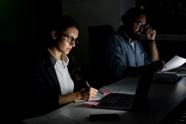 Free photo business teammates working late