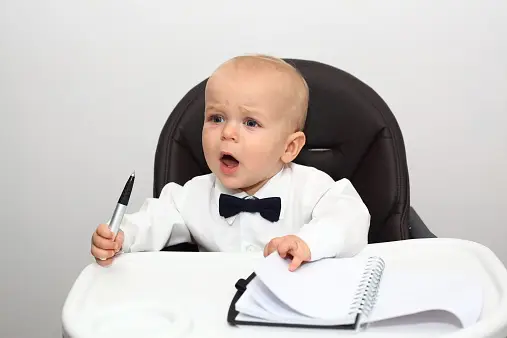 a baby in a suit taking business decisions