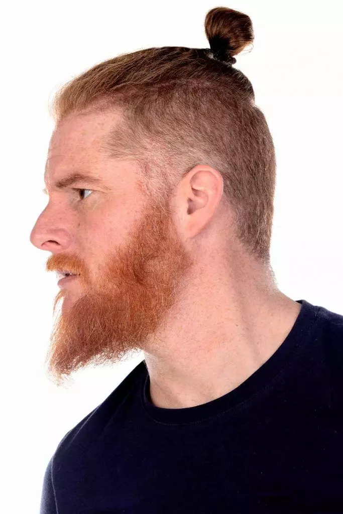 Side view of a man with top knot viking hairstyles