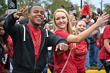 A group of students engaging in extracurricular activities, including sports, music, and community service, on a college campus.