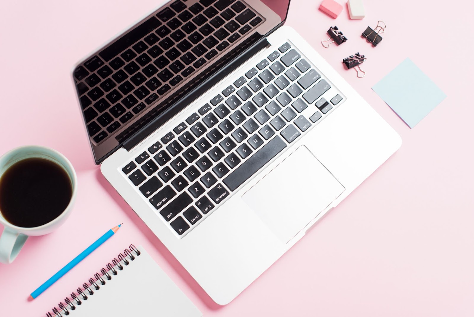 Macbook keyboard and pink background
