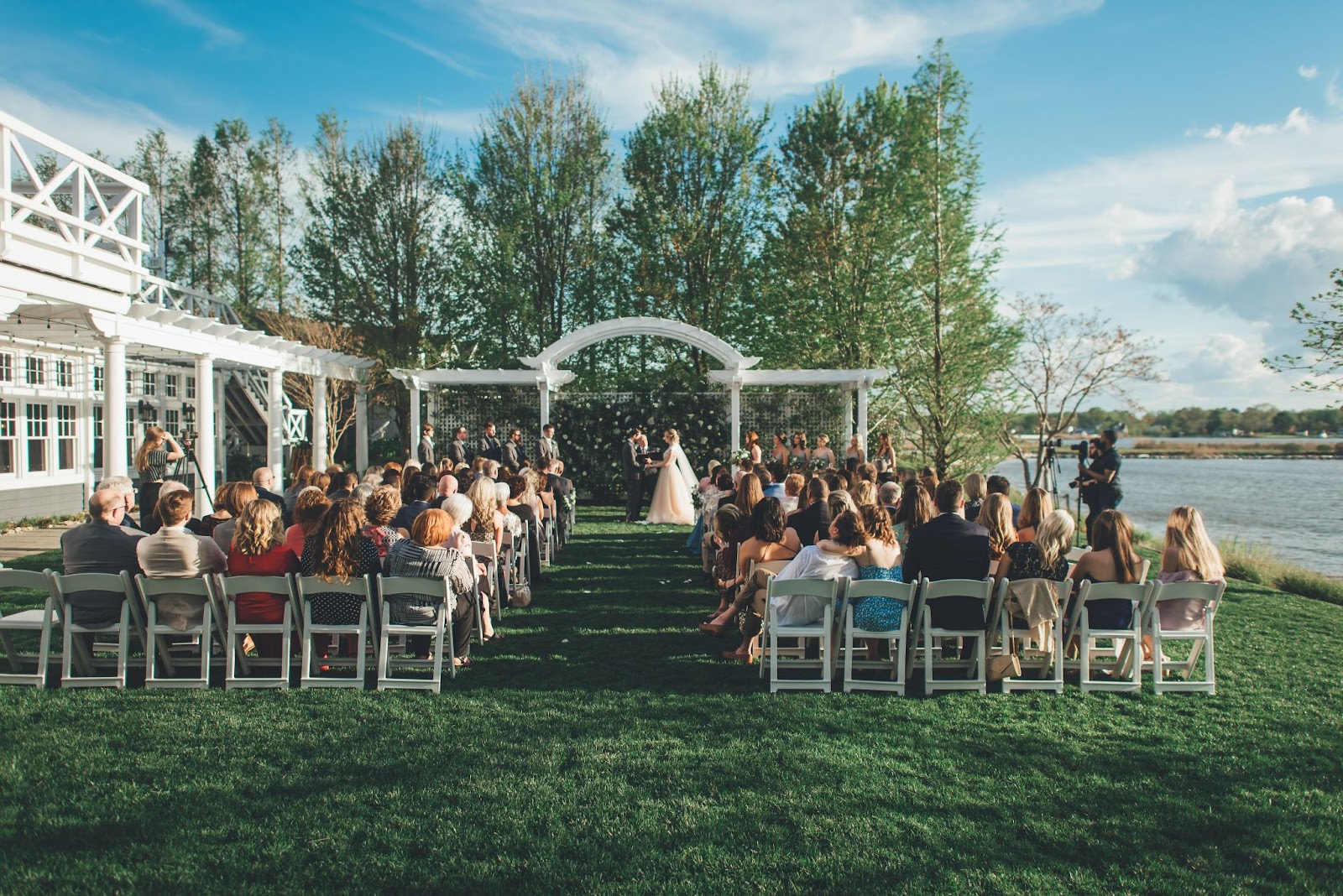 Outdoor wedding ceremony taking place outside of the Chesapeake Bay Beach Club