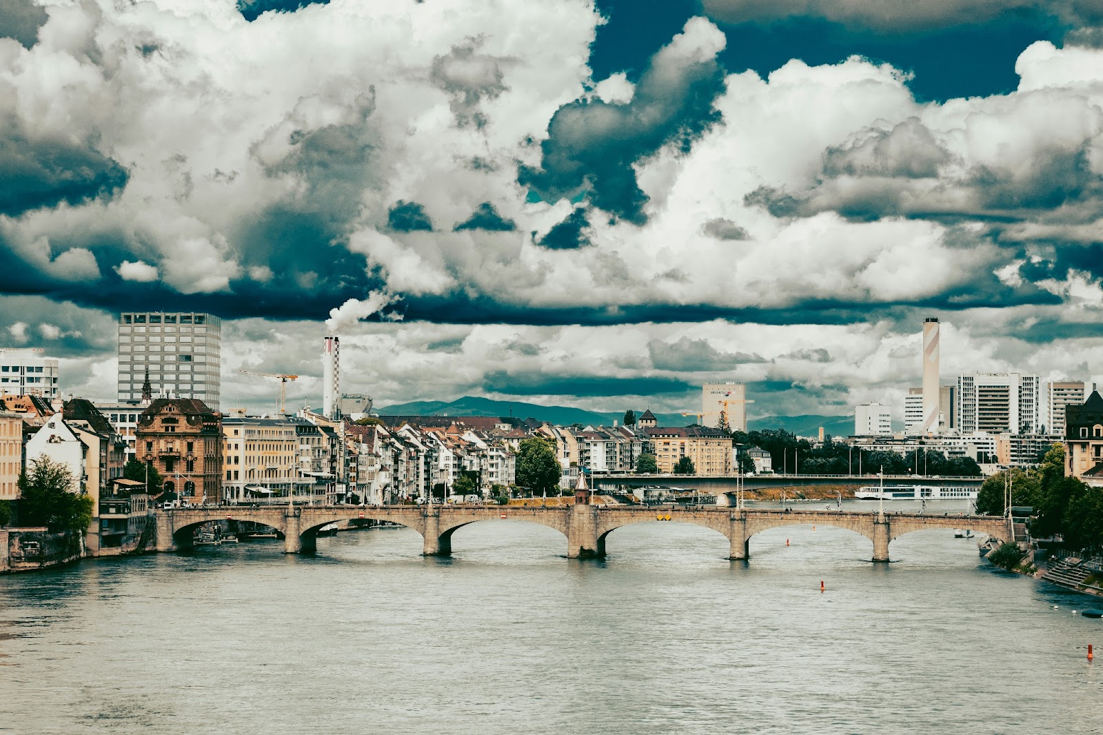 View of the Rhine river with the bridge connecting the enchanting Old Town of Basel. 