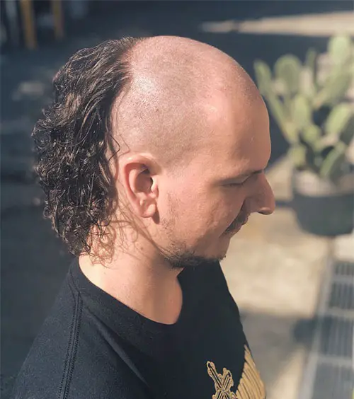 Picture of a  man wearing the stylish curly hairdo