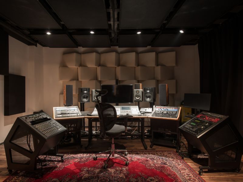 An empty control desk in a music studio room. 