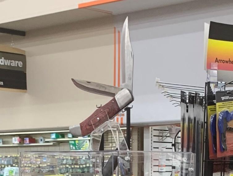 A pocket knife on a display Description automatically generated