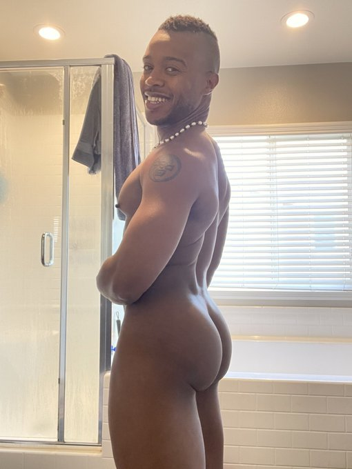 Jake Waters standing for an iphone mirror selfie naked showing off his hairless gay bubble butt