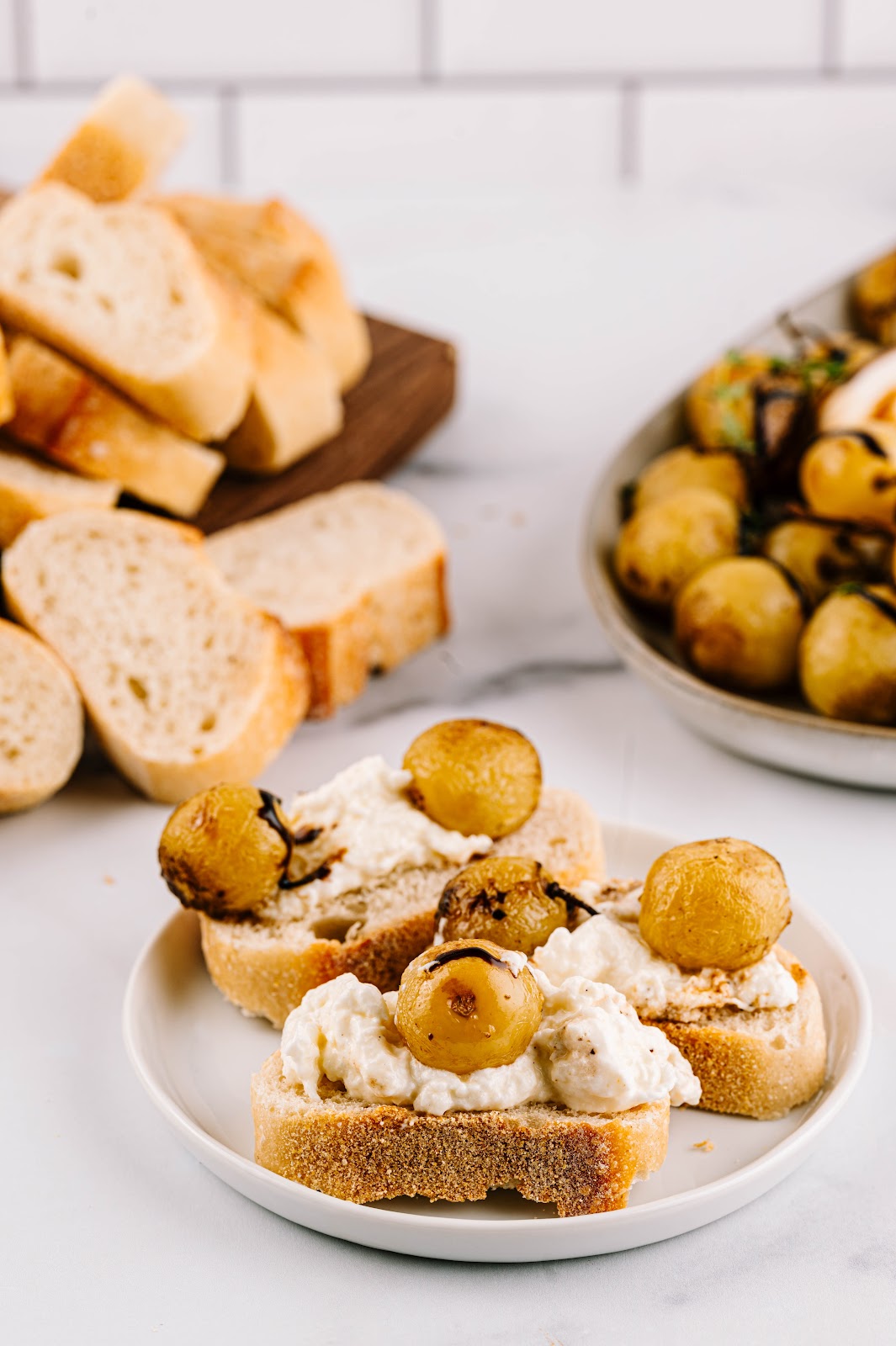 Sun World grapes on a baguette with burrata spread.