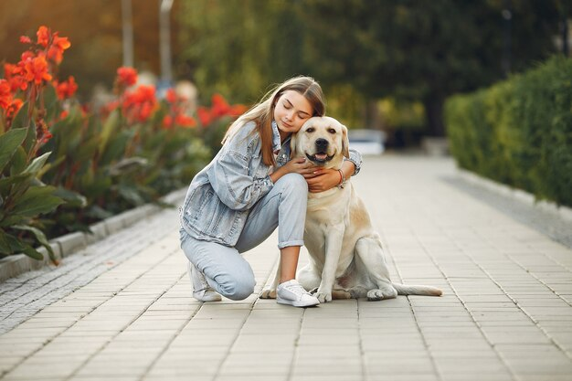 An adorable photo of a dog mom hugging her dog.