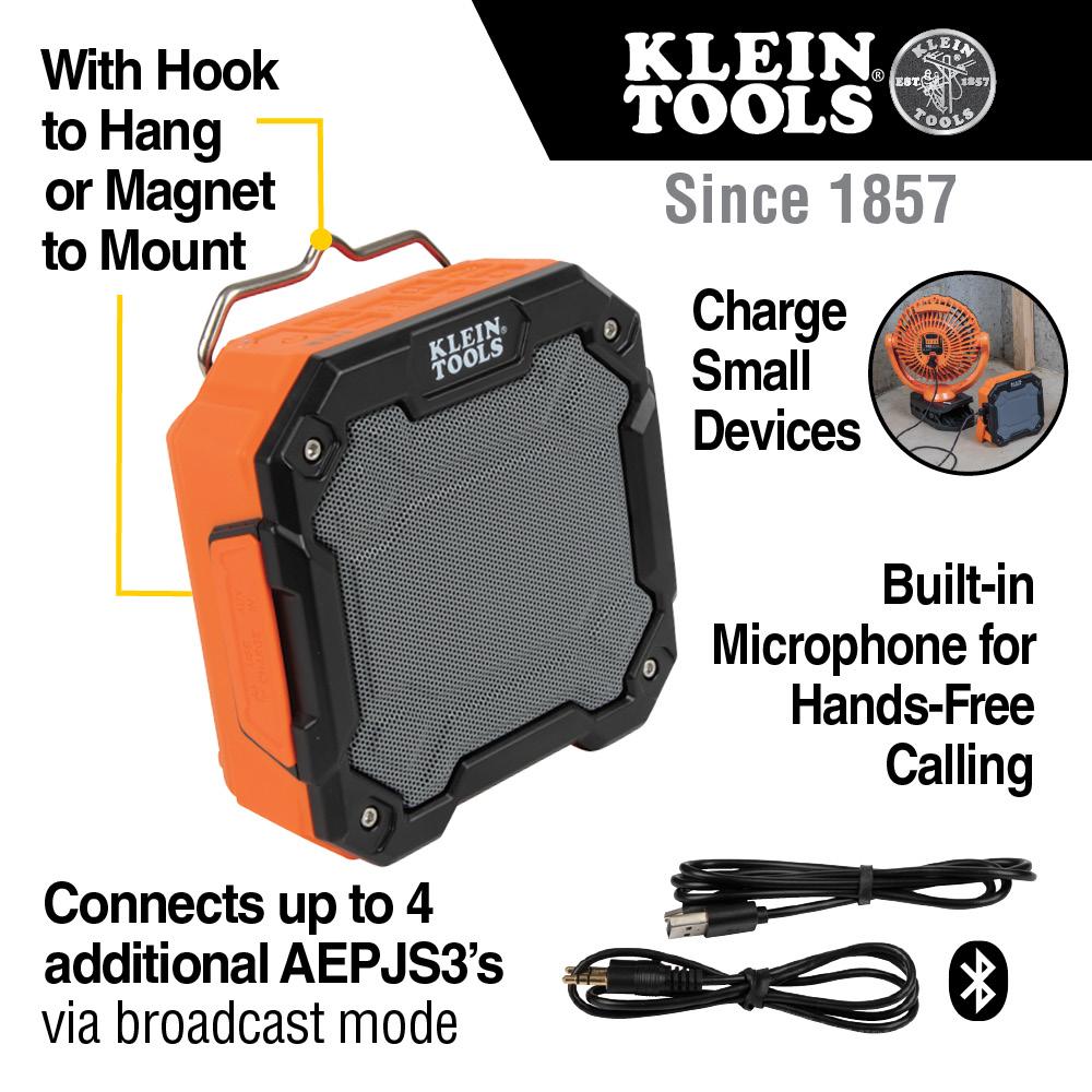 An orange and black speaker with a black cord

Description automatically generated