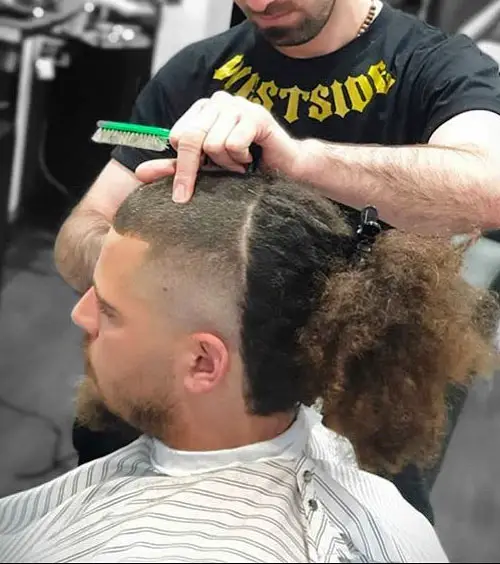Picture of a man getting hair his cut