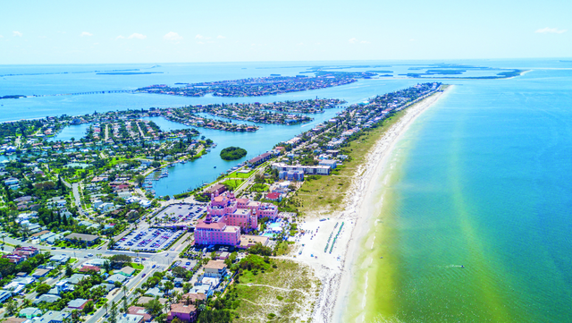 St. Pete Beach is situated on a barrier island along the Gulf Coast of Florida, near St. Petersburg. It is famous for its quiet atmosphere, pristine white sand, and breathtaking sunsets. 