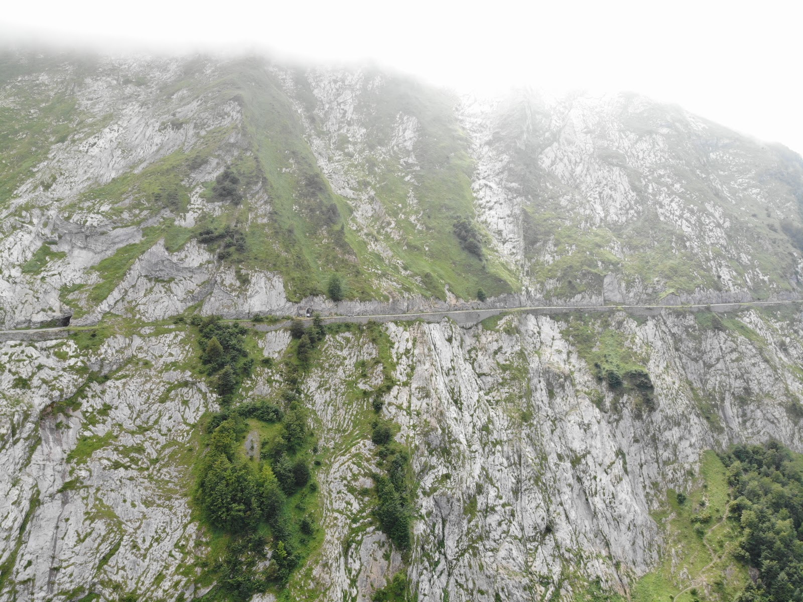 Cycling Col d'Aubisque  from Argeles Gazost - aerial drone photo from ravine of roadway and tunnel