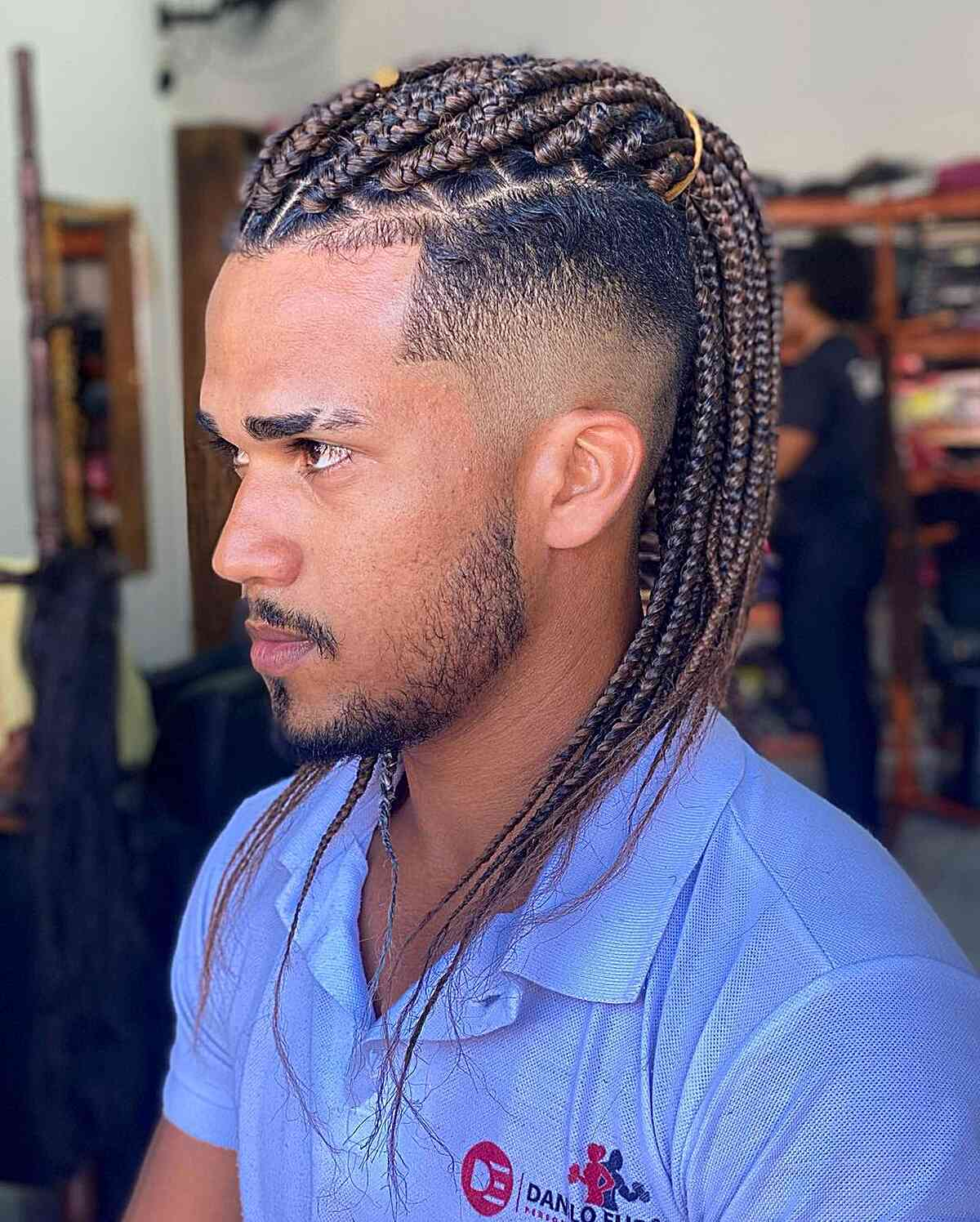 Picture showing a guy rocking long braids 