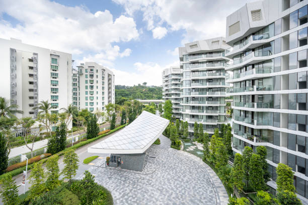 A group of buildings with trees and a walkway

Description automatically generated